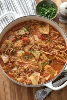 a pot of cabbage roll soup with a striped towel