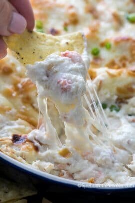 Dipping a chip in crab rangoon dip