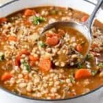 Beef Barley Soup in a pot with a ladle