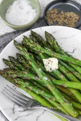 Asparagus on a plate with a fork