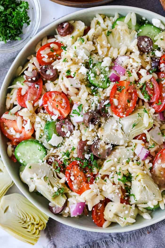 Mediterranean Orzo Salad with cucumbers and artichokes and tomatoes