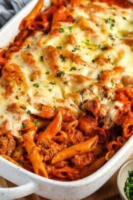 cooked Creamy Baked Mostaccioli in a white casserole dish