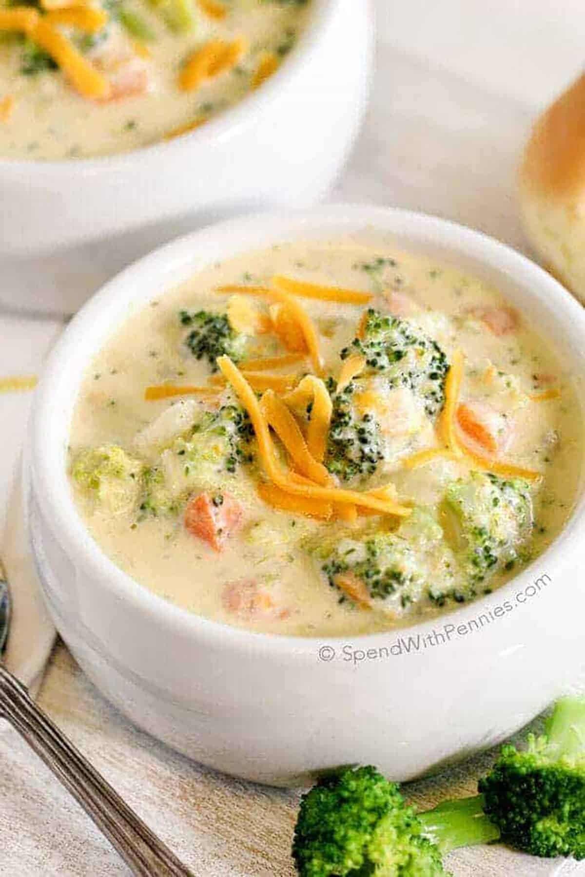 20 Minutes Broccoli Cheese Soup in a white bowl with cheese