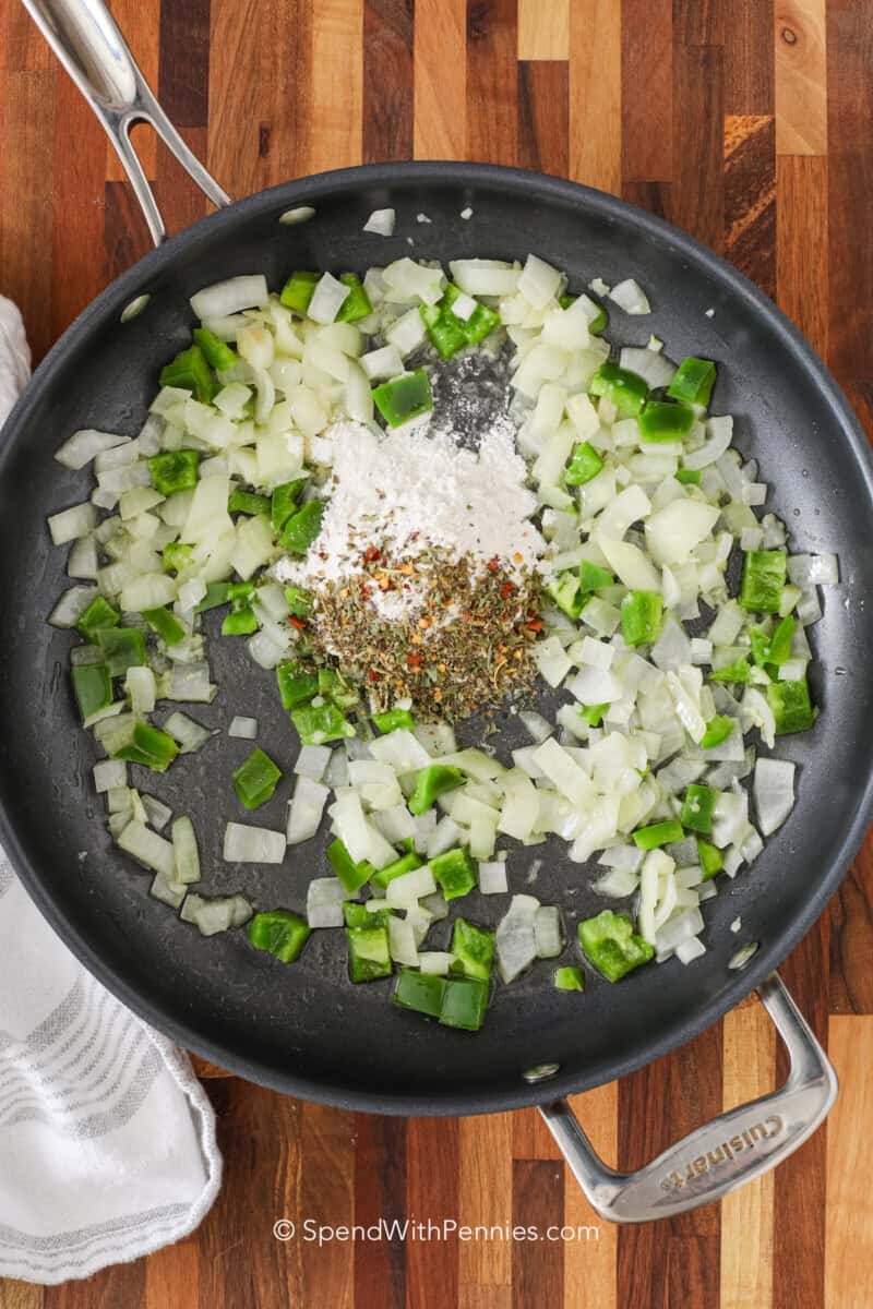 ingredients for the sauce for chicken spaghetti in a skilleta