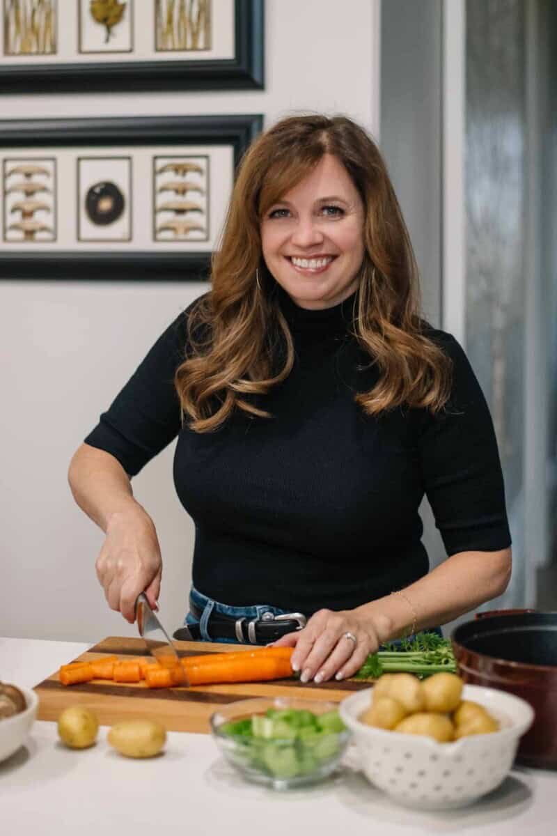 Holly Nilsson preparing vegetables in her kitchen