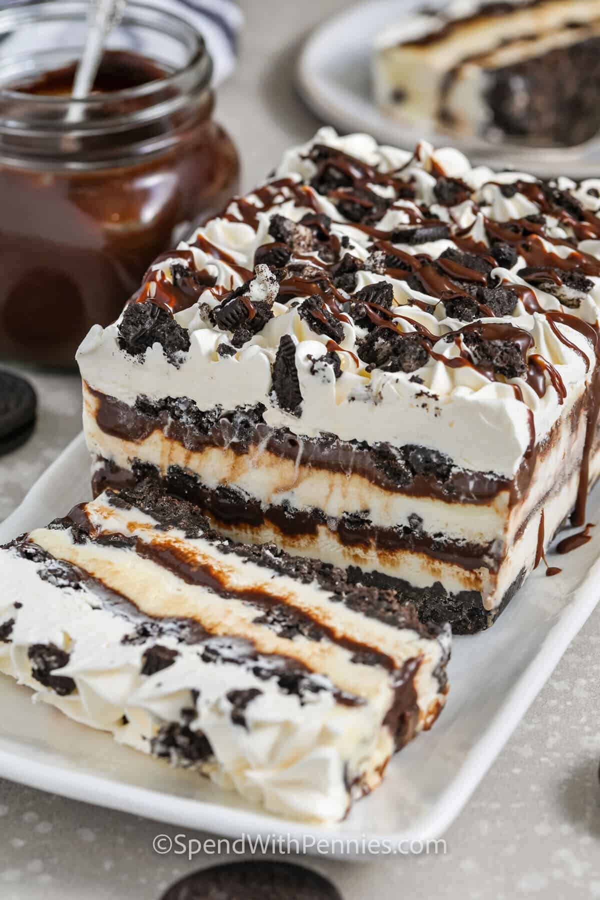 Oreo Ice Cream Cake on a plate with a slice cut out